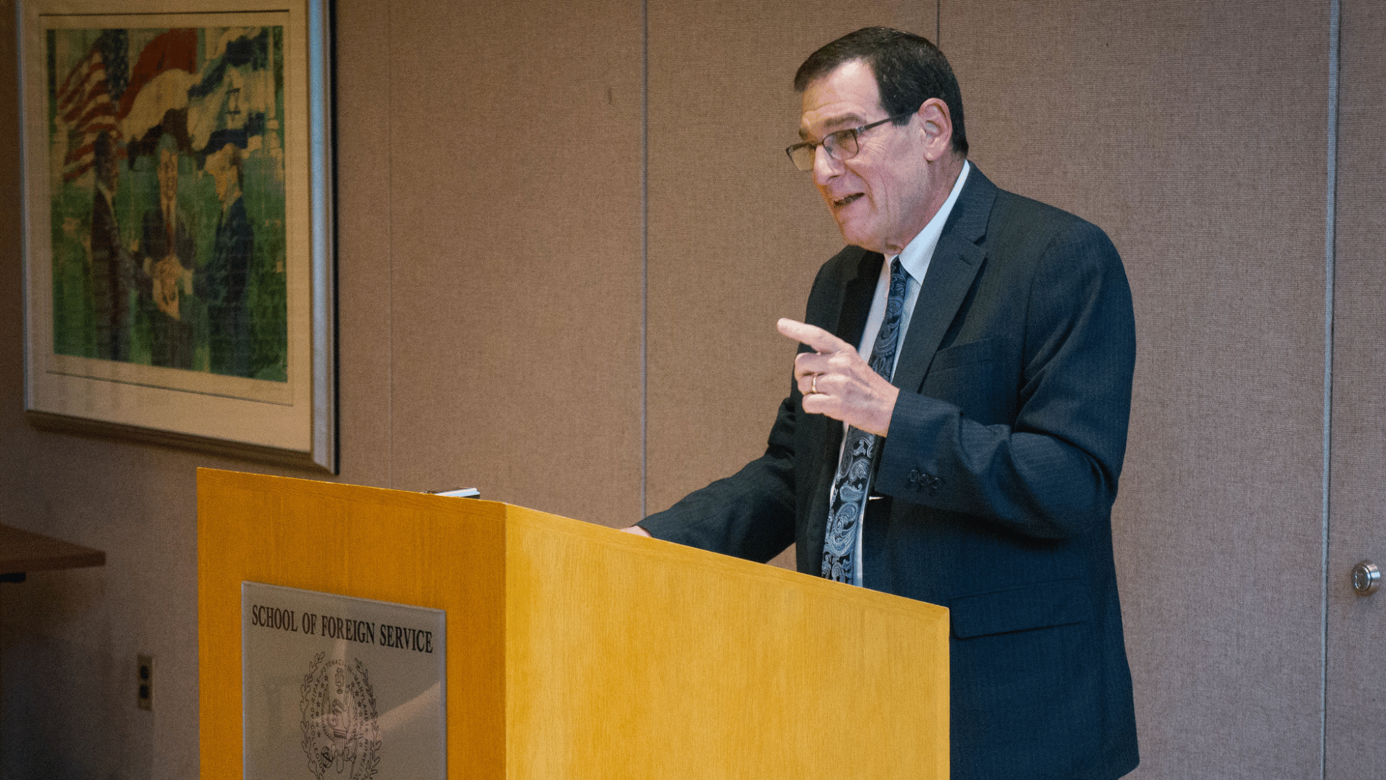 Ambassador Jimmy Kolker speaking.
