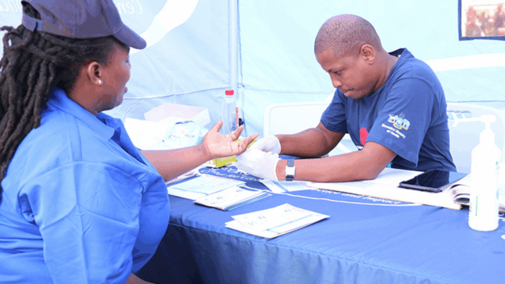A CGHPI HIV testing counselor with a client in the Lubombo region of Eswatini during a community outreach event.