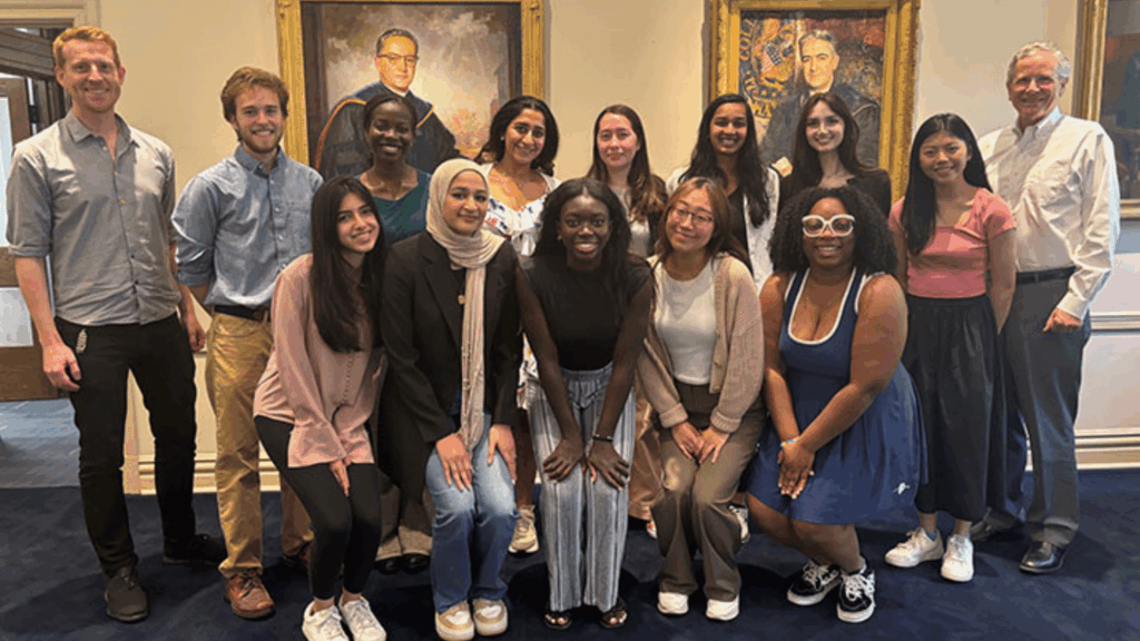 Picture of Spring 2024 Global Health Student Fellows with GUGHI Managing Director Dr. Oliver Johnson (left) and Senior Advisor John Monahan.