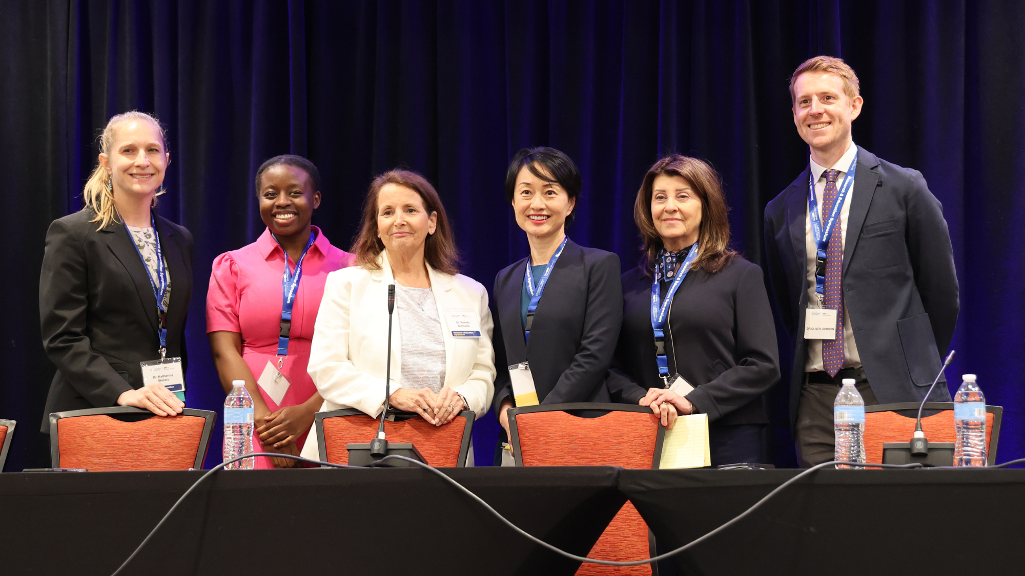 Six panelists standing up