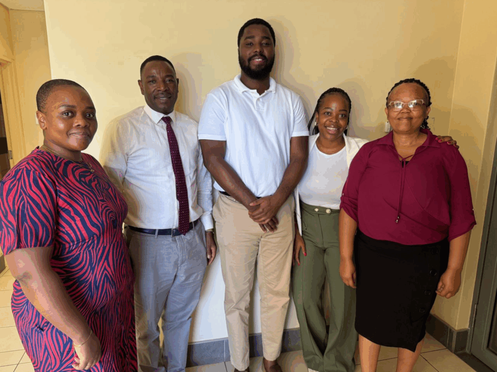 Dr. Akyeampong (center) with the Center for Global Health Practice and Impact Eswatini team.