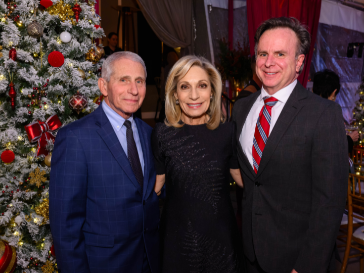 Dr. Anthony Fauci, Andrea Mitchell, and Norman J. Beauchamp Jr. stand and pose for a photo.