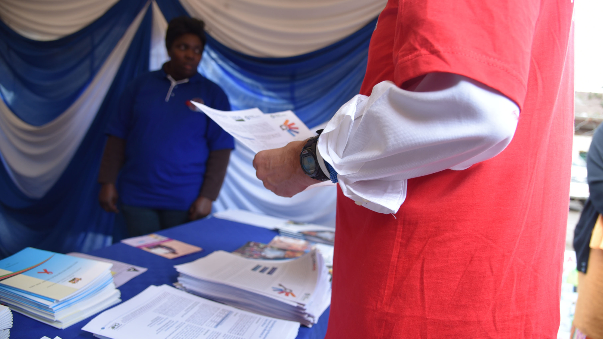 A person holding a piece of paper.