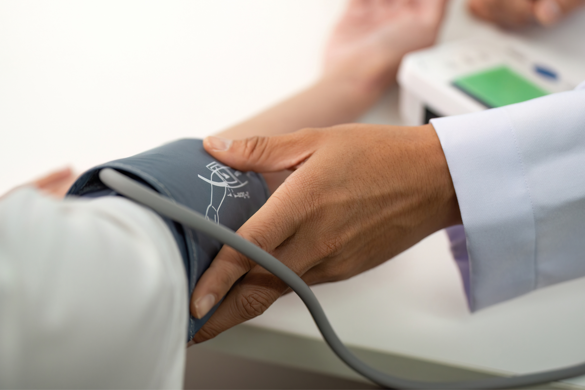 Health professional taking blood pressure