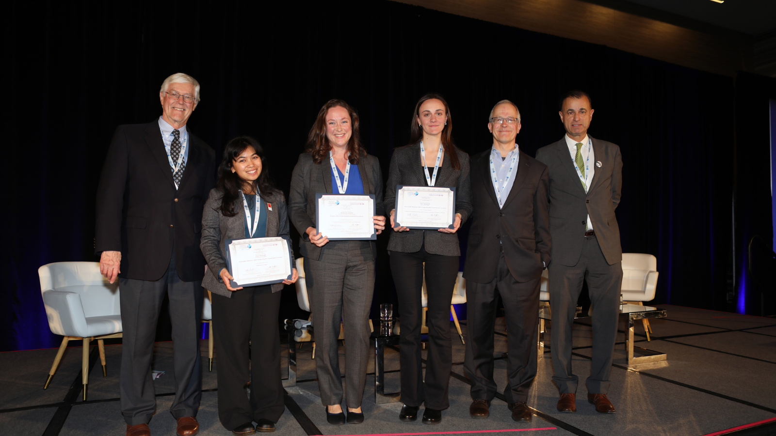 A group shot of people receiving certificates.