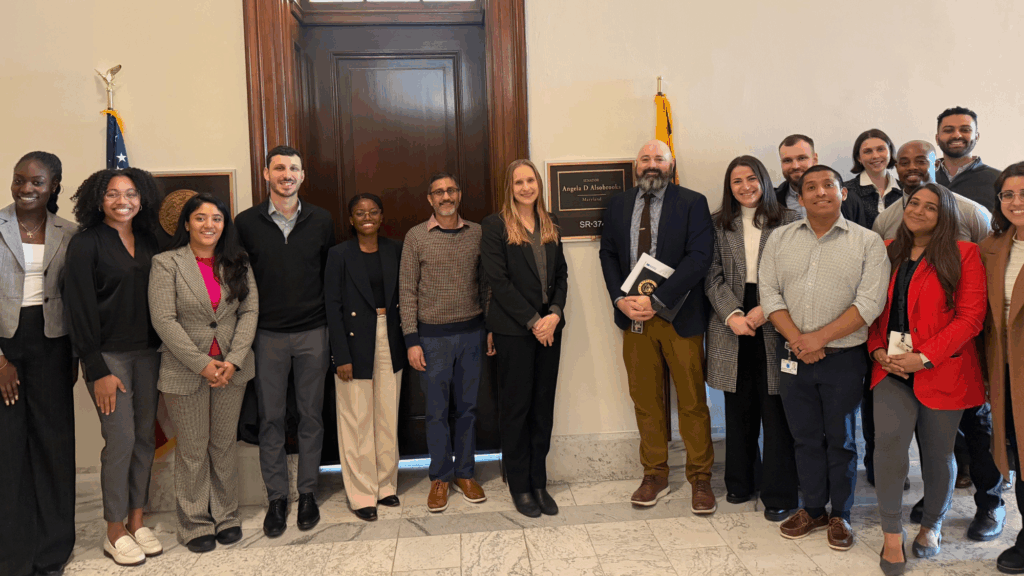 Kayla Wontumi (H’27), a Global Health Student Fellow and Maeve Kennedy McKean Award recipient, with residents and faculty outside Senator Angela Alsobrooks’ (D-MD) office.