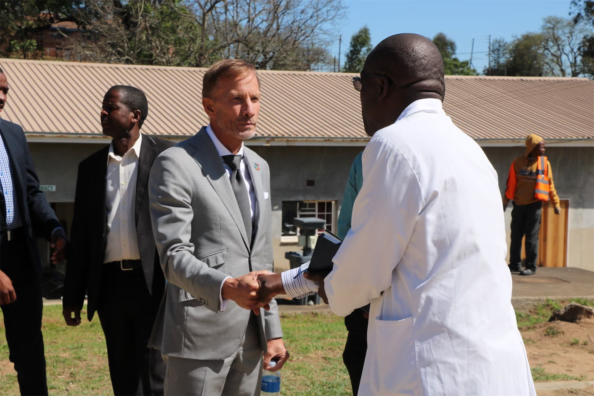 Two individuals shaking hands